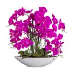 Artificial plant orchid in white ceramic bowl