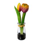 Artificial flower tulips in glass vase