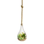 Artificial plants in glass with decorative stones and LED